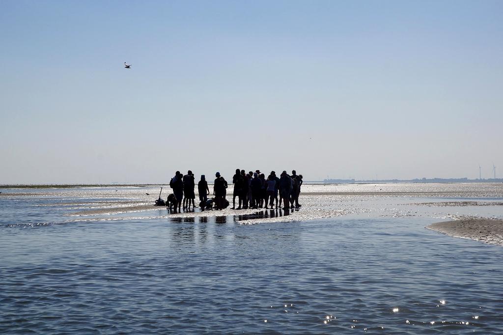 Vagabond tour group hiking on a coastal trail